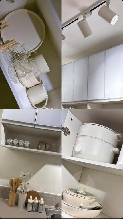 a kitchen with white cabinets and a toilet in it at Casa Lyra Staycation Trees Residences in Manila