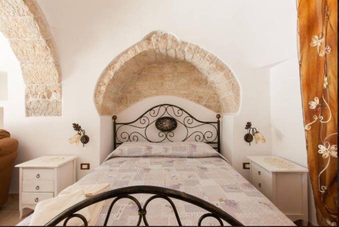 A bed or beds in a room at Trullo Abbracciavento