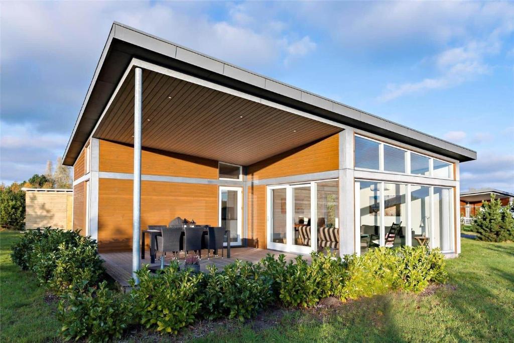 a house with large glass doors and windows at M14010-Vaeggerlose-Savavej-29 in Marielyst