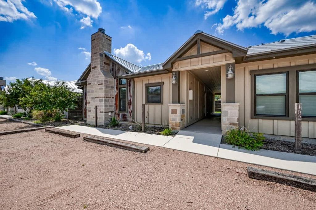 a house with a driveway in front of it at The Ricardo in Fredericksburg