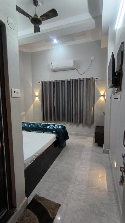 Katil atau katil-katil dalam bilik di SMB Paying Guest House