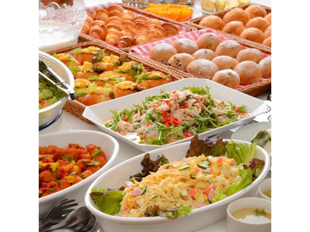 a buffet filled with different types of salads and pastries at Smile Hotel Sakurambo Higashine - Vacation STAY 29987v in Higashine