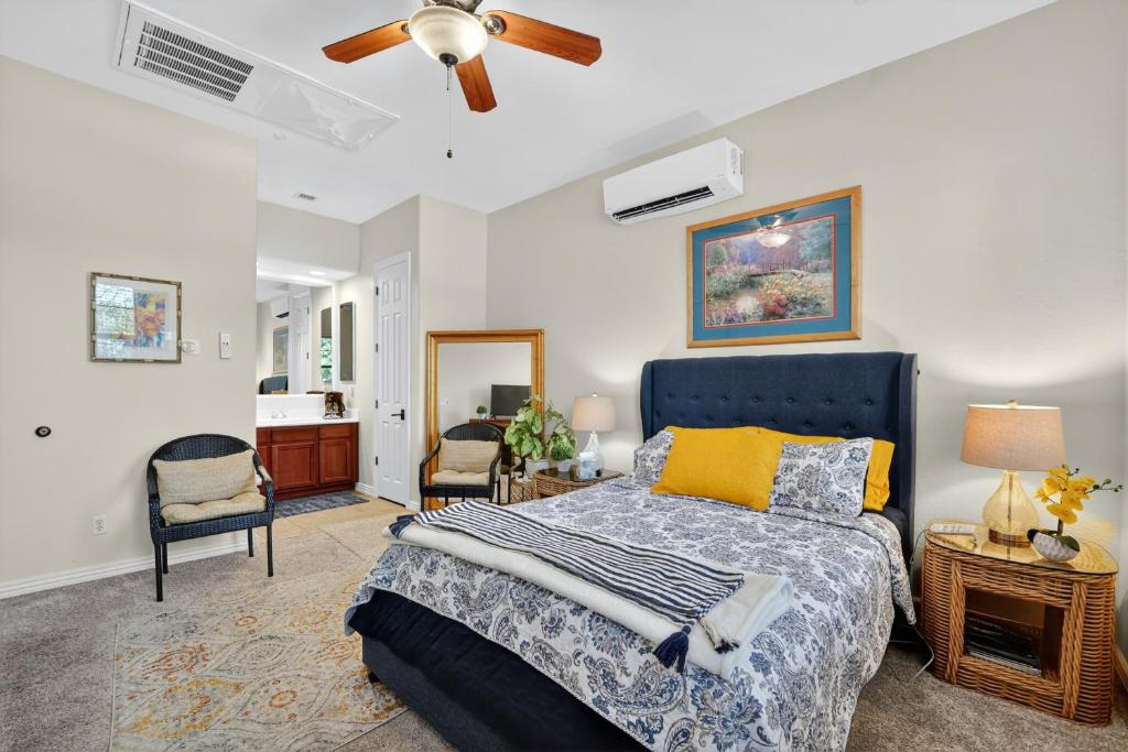 a bedroom with a bed and a ceiling fan at Elm Casita Apts in Litchfield Park