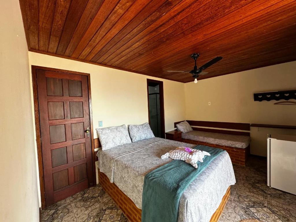 Katil atau katil-katil dalam bilik di Bem Natural - Pousada e Camping