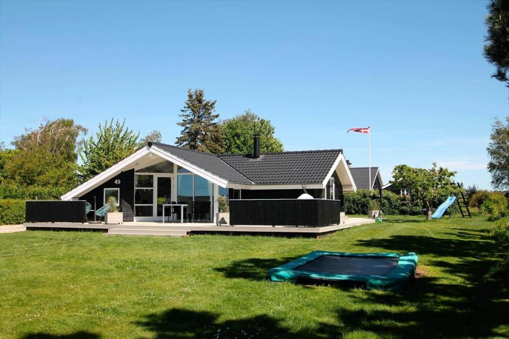 a house with a green lawn in front of it at SL310-Slagelse-Birkevej-49 in Slagelse
