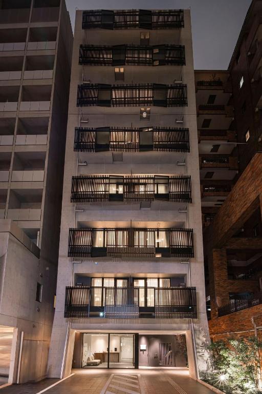 a tall building with several balconies on it at Cava House - Vacation STAY 07286v in Tokyo