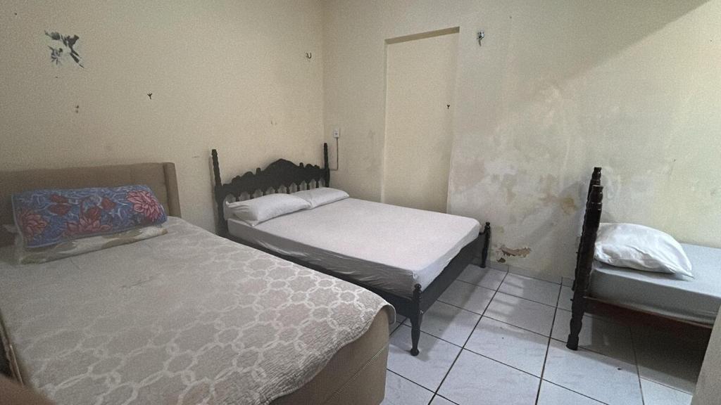 En eller flere senge i et værelse på Paraíso Oculto