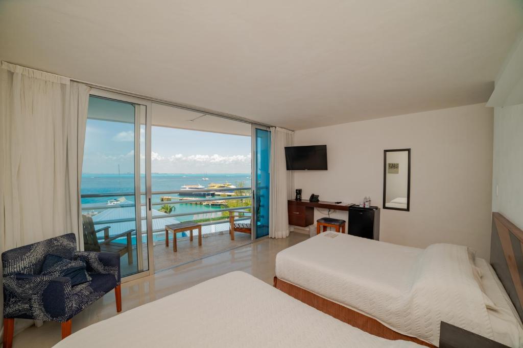 Ένα ή περισσότερα κρεβάτια σε δωμάτιο στο Hotel Bahia Chac Chi