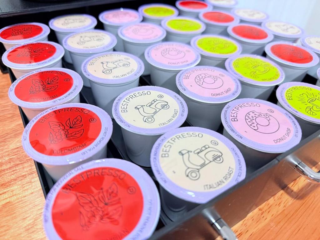 a bunch of cups with different colored labels on them at Modern Studio with Exterior Independent Entrance in Orlando