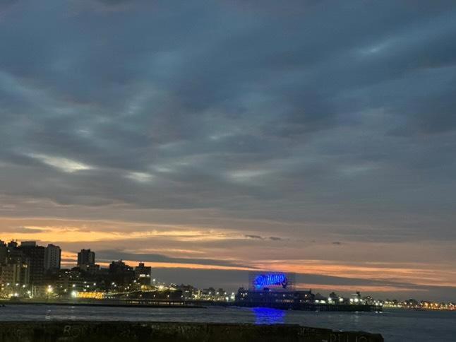 a view of a city at night with blue lights at VISTA AL MAR HOSPEDAJE Solo mujeres in Mar del Plata