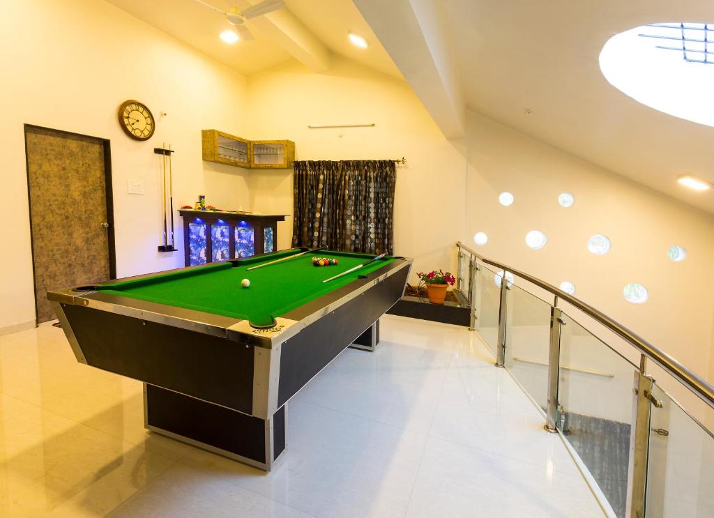 a billiard room with a pool table in a house at Aneesha Bunglow in Mahabaleshwar