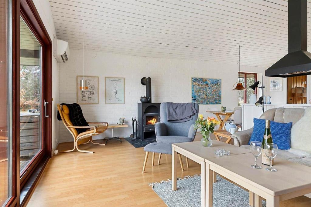 a living room with a couch and a table at TV1651-Bindslev-Vestervej-54 in Bindslev