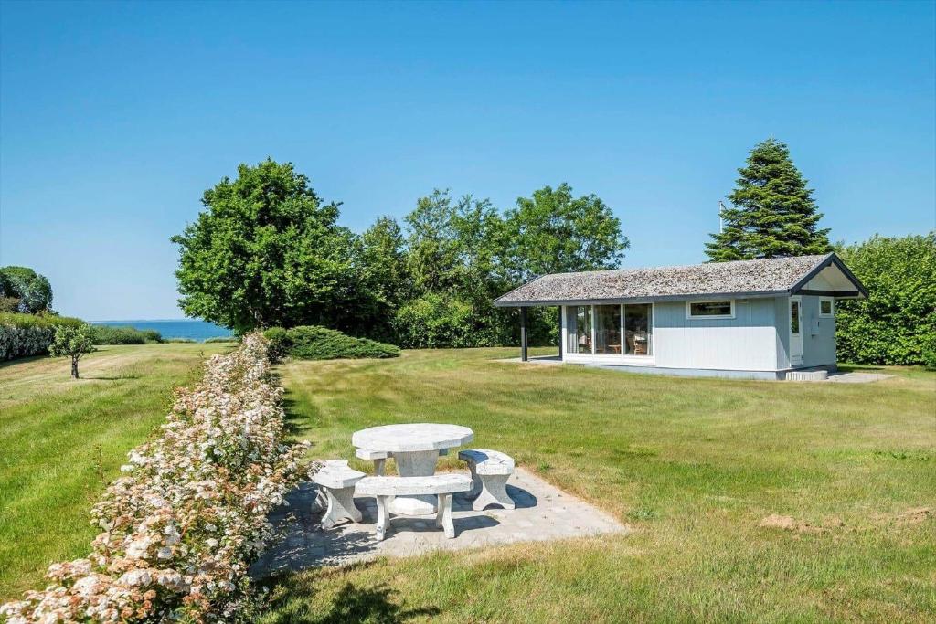 a picnic table in front of a small house at SB50361-Nordborg-Krabbestien-11 in Nordborg