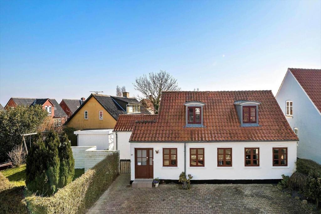 a white house with a red roof at AE216-Marstal-Hovedgaden-27 in Marstal