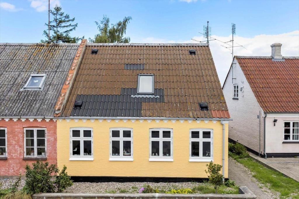 a yellow house with a brown roof at AE219-Marstal-Ommelsvejen-14 in Marstal