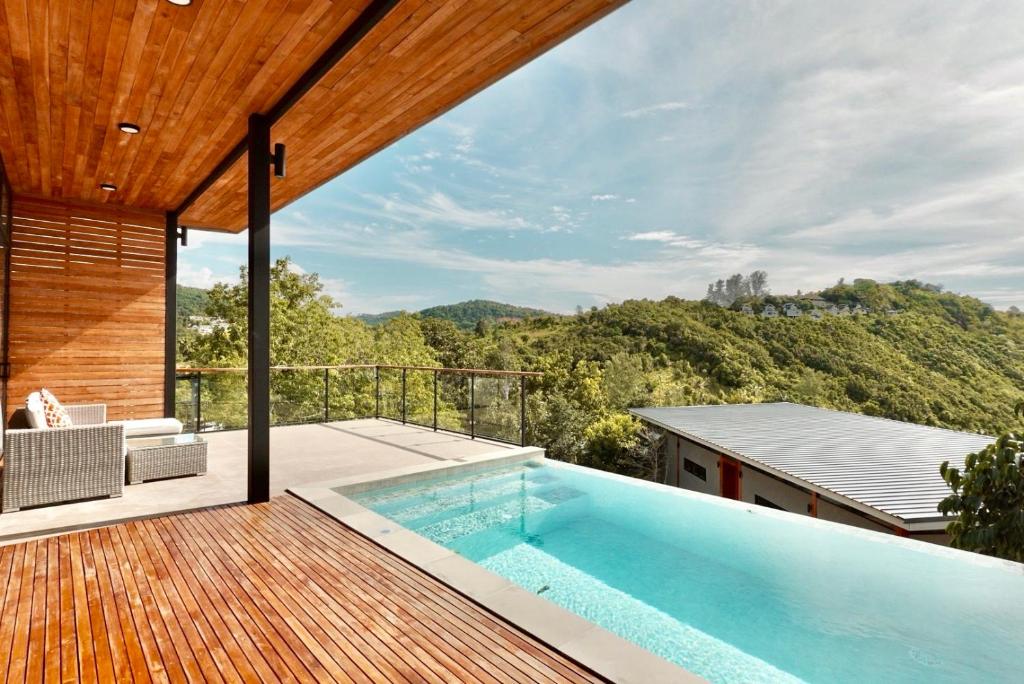a swimming pool on the deck of a house at Yume17 - Sea View Villas in Chaloklum