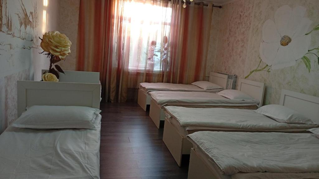 Ένα ή περισσότερα κρεβάτια σε δωμάτιο στο Guest House StarSky