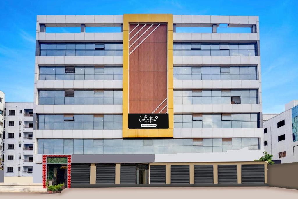 a building with a sign on the side of it at Super Collection O Manjari - Mundhwa Road Formerly 7 Treats in Mundhwa