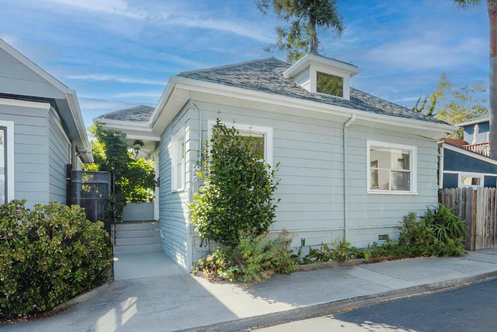 a small white house on a street at Allura Oakland Your Private Sanctuary in the City in Oakland
