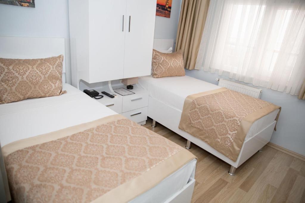 Postel nebo postele na pokoji v ubytování Lavanta Hotel
