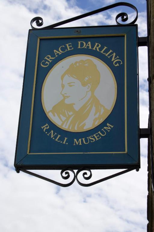 a sign for a dance dance dancing rental museum at Pintail Apartment Bamburgh in Bamburgh