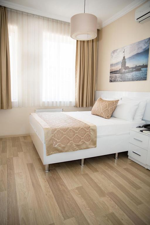 Postel nebo postele na pokoji v ubytování Lavanta Hotel