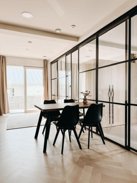 a dining room with a table and chairs at Neliapila's two-room apartment in Kokkola