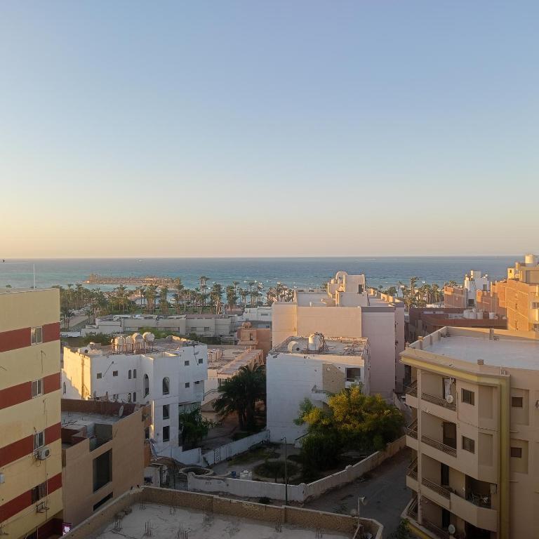 a view of a city with the ocean in the background at Hurghada Red Sea Apartments in Hurghada