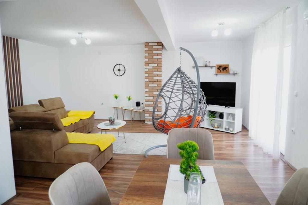 a living room with a couch and a table at Vila Elena in Gevgelija