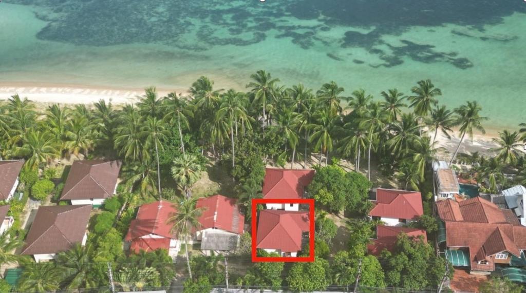 an aerial view of a resort with palm trees at One bedroom beach house near Lamai in Hua Thanon Beach