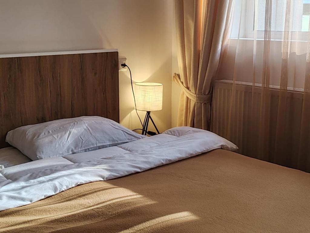 Ένα ή περισσότερα κρεβάτια σε δωμάτιο στο Tribu