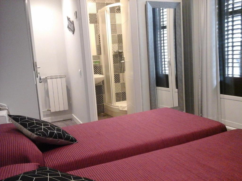 Letto o letti in una camera di Hostal Don Alfonso