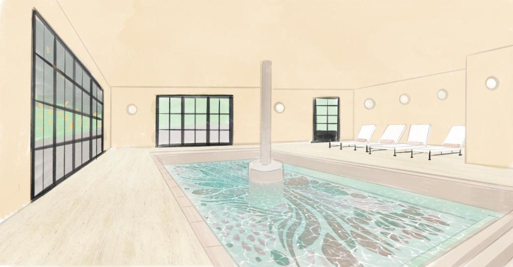 a large room with a pool in the middle of it at Verneuil la douce in Verneuil d’Avre et d’Iton