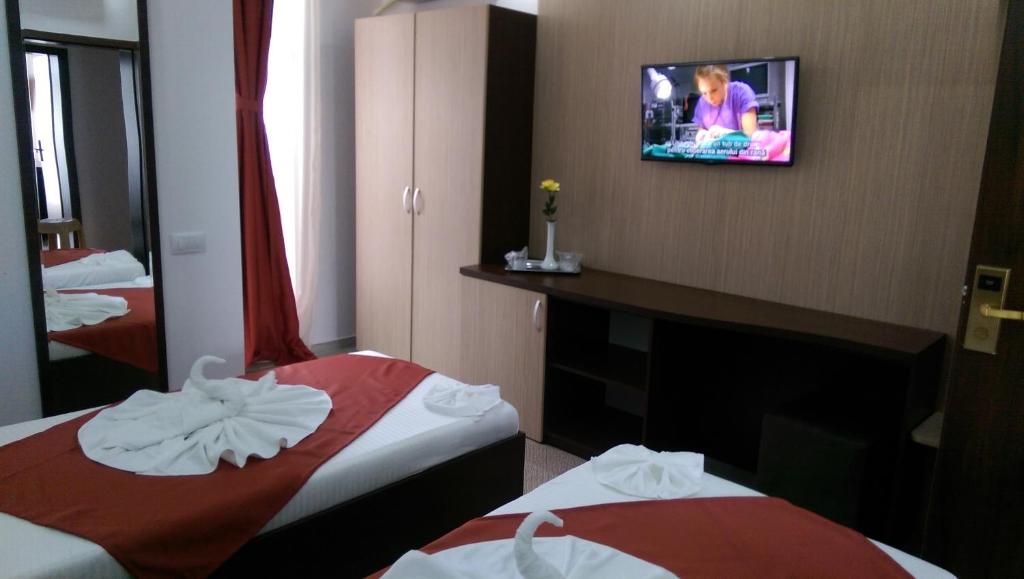 Postel nebo postele na pokoji v ubytování Hotel Evia