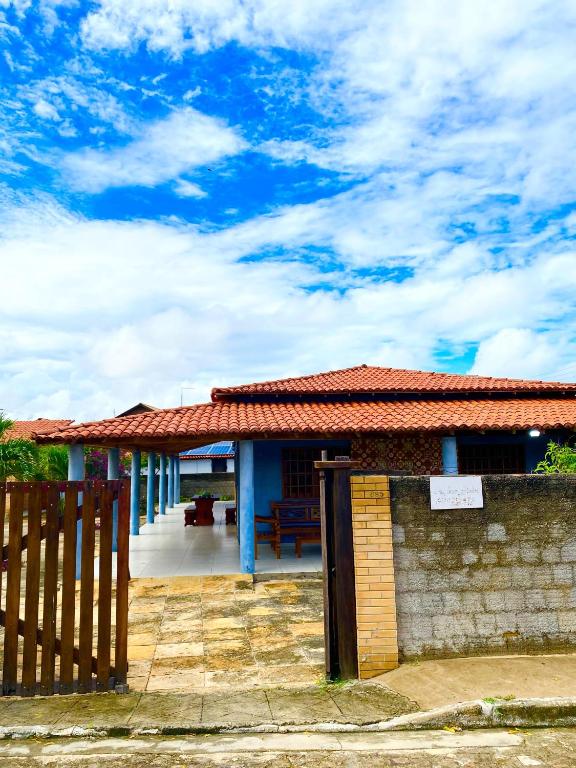 a house with a fence in front of it at Casa Pierot in Luis Correia
