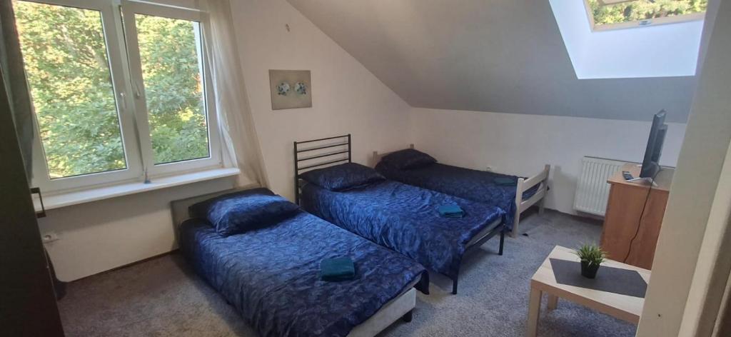 Postel nebo postele na pokoji v ubytování Gdańsk Wrzeszcz Morskie Pokoje