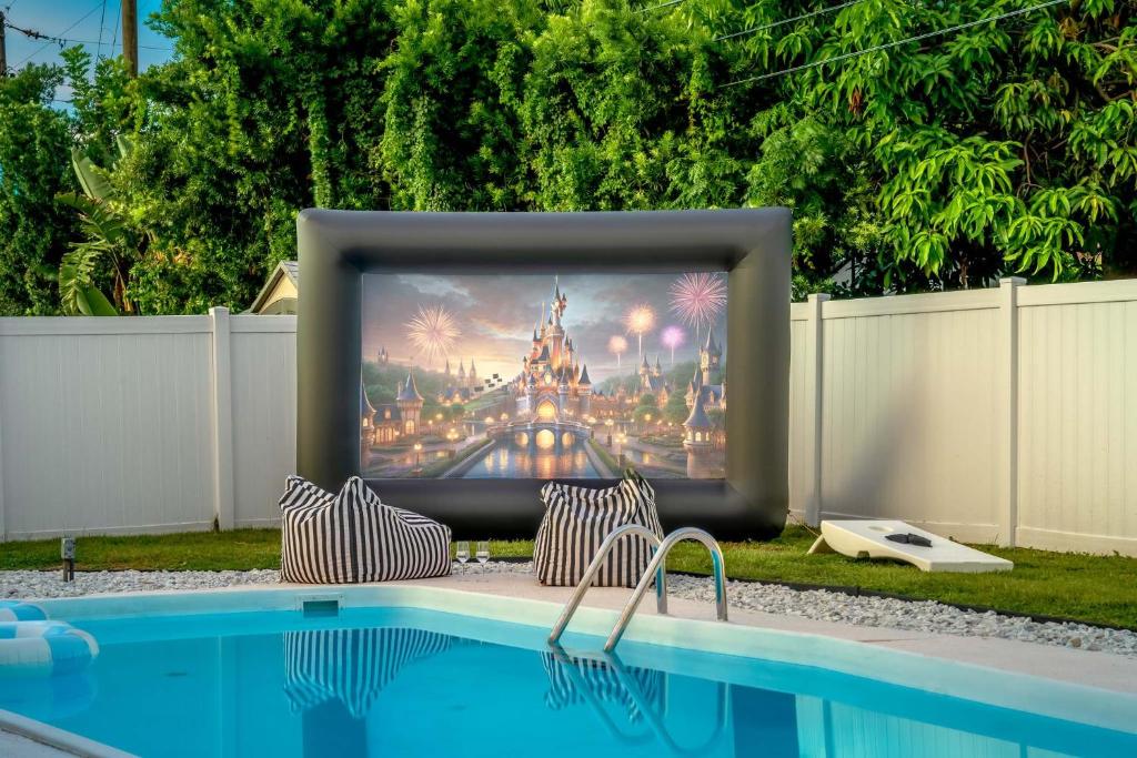 a tv screen sitting on top of a pool at The Beverley Pool Hot Tub Near Clearwater Beach in Clearwater