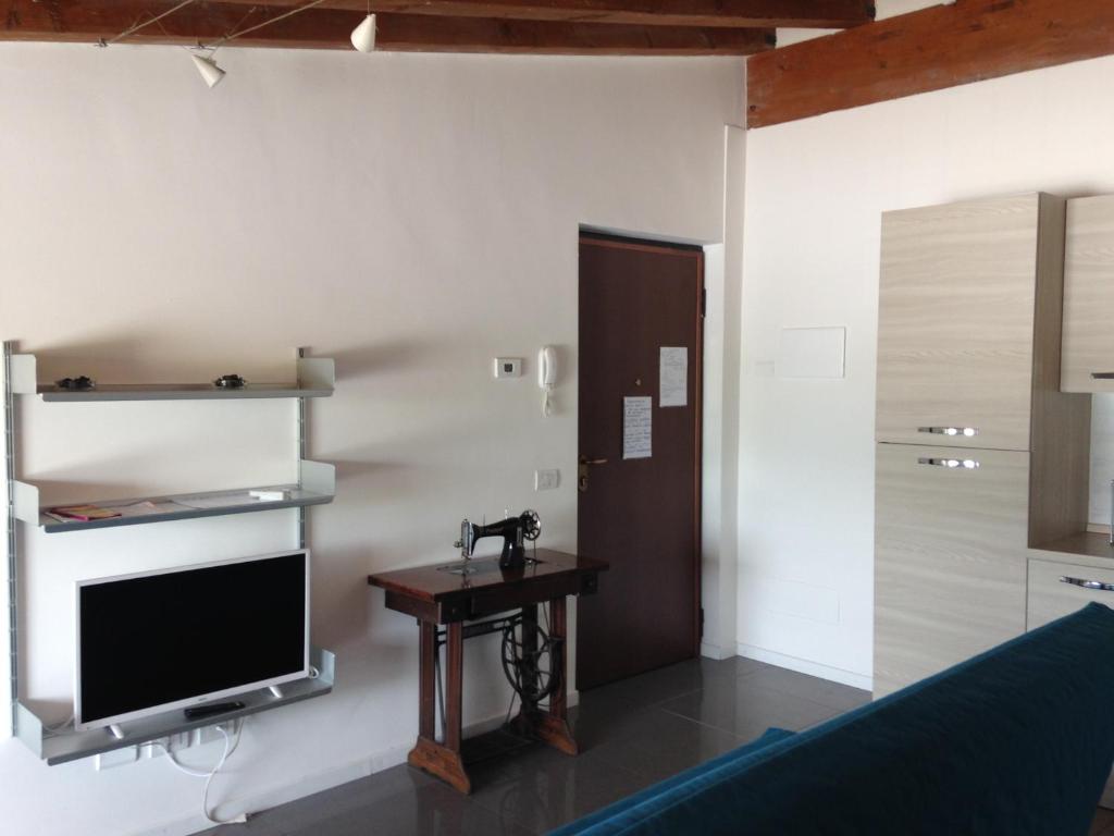 Telewizja i/lub zestaw kina domowego w obiekcie Milano Canal Apartments