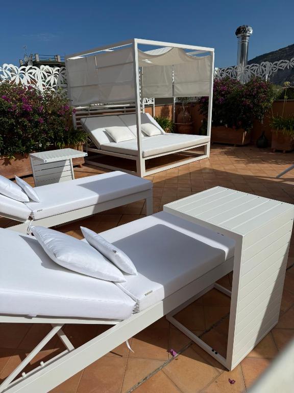 two white beds sitting on top of a roof at The Rooftop Terrace b&b Two Double Rooms with private bathrooms and an equipped roof terrace in Sant'Agnello