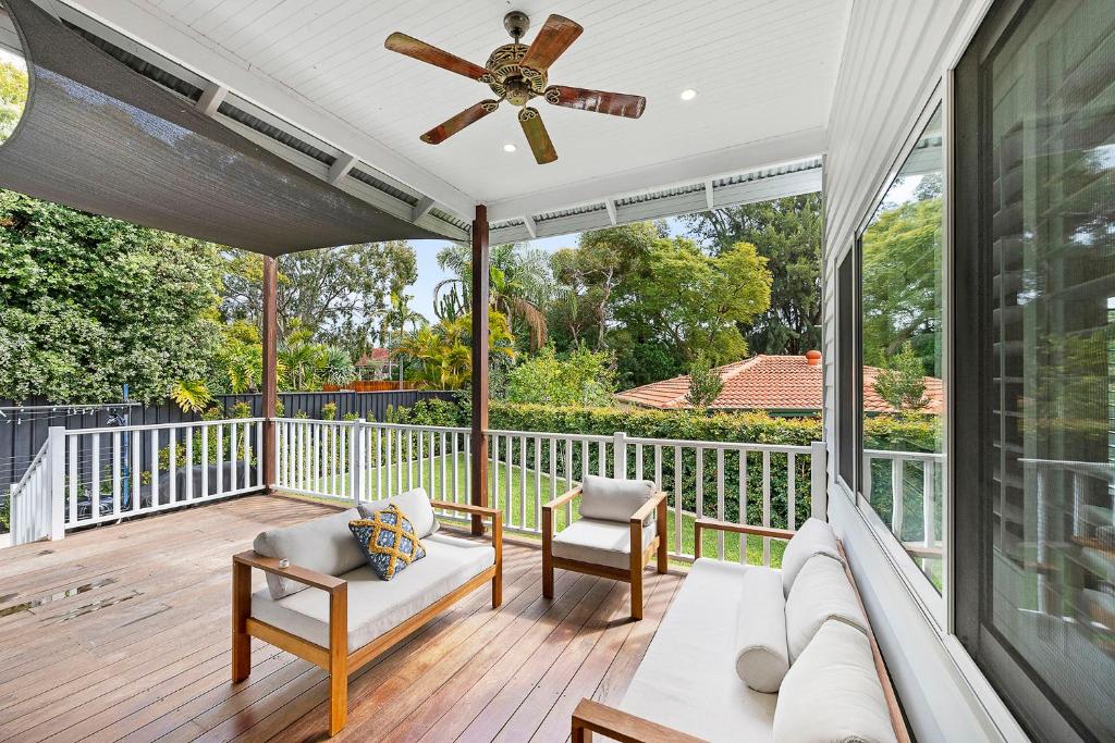 a porch with a couch and a ceiling fan at Stunning Bayswater Home Large Deck, BBQ in Perth