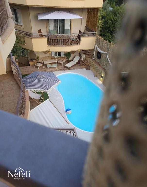 an overhead view of a swimming pool in a hotel at Nefeli Villa lagonisi - Pool in Lagonissi