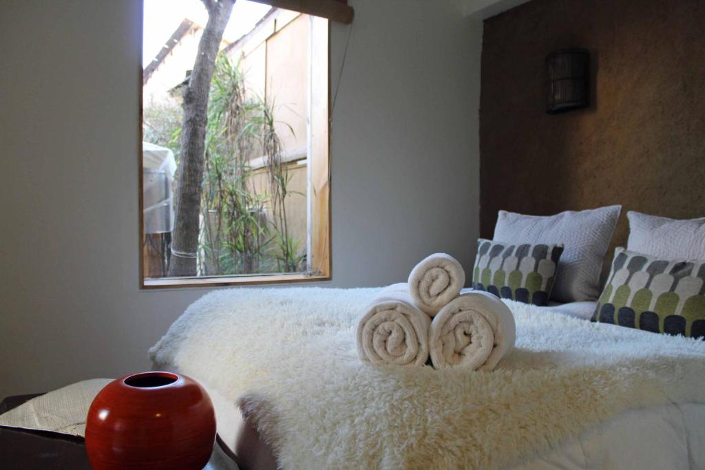 Postel nebo postele na pokoji v ubytování Hotel Boutique Terra Diaguita & Spa