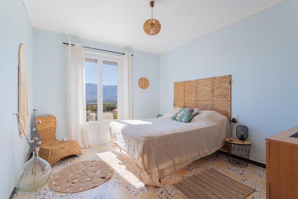 Postel nebo postele na pokoji v ubytování Les Albères