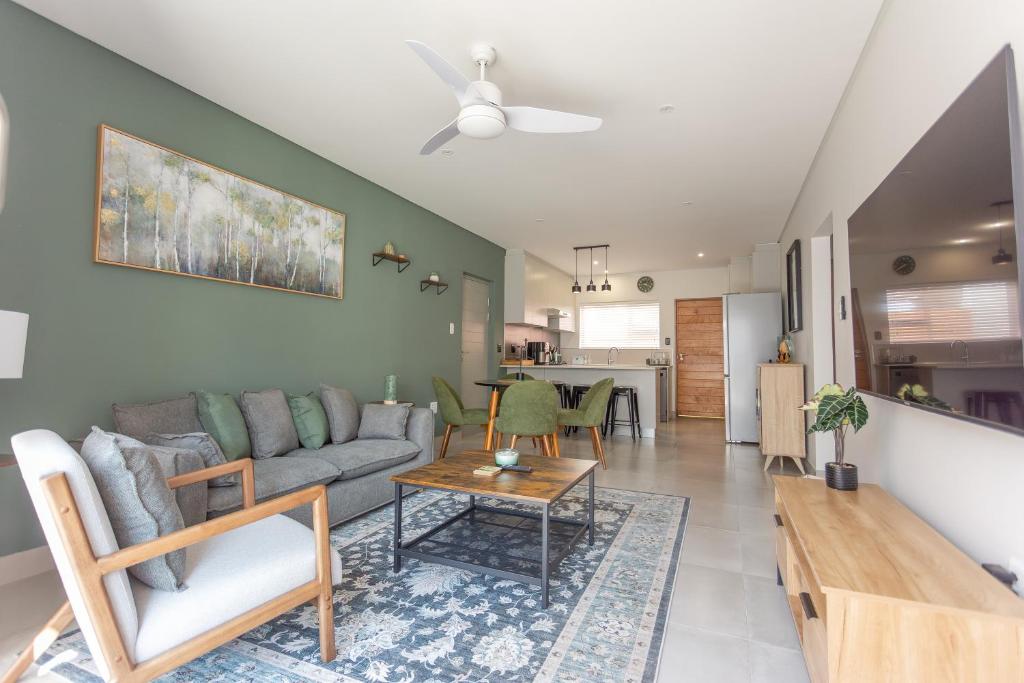 a living room with a couch and a table at No 19 at 1 on York - luxury townhouse in George