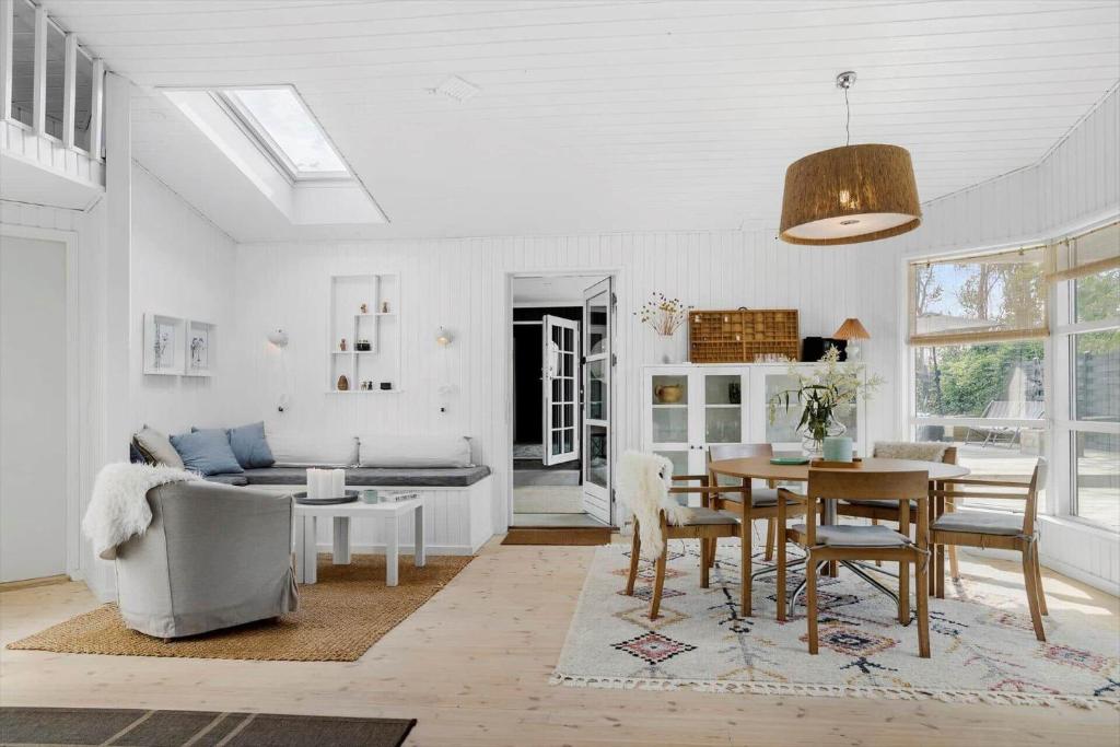 a living room with a table and a couch at 30192-Malling-Askvaenget-13 in Malling