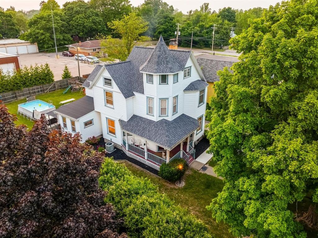 an aerial view of a large white house at Heated Pool, Hot Tub, Walk to Town, Games! in South Haven