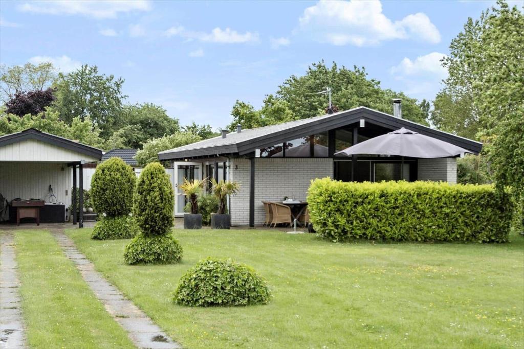 a house with a lawn in front of it at 30536-Odder-Strandagervej-3 in Odder