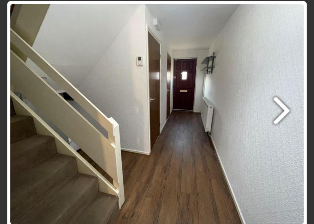 an empty hallway with stairs and a door at Newcastle No 30 Stay for Contractors, Families & Professionals in Heaton