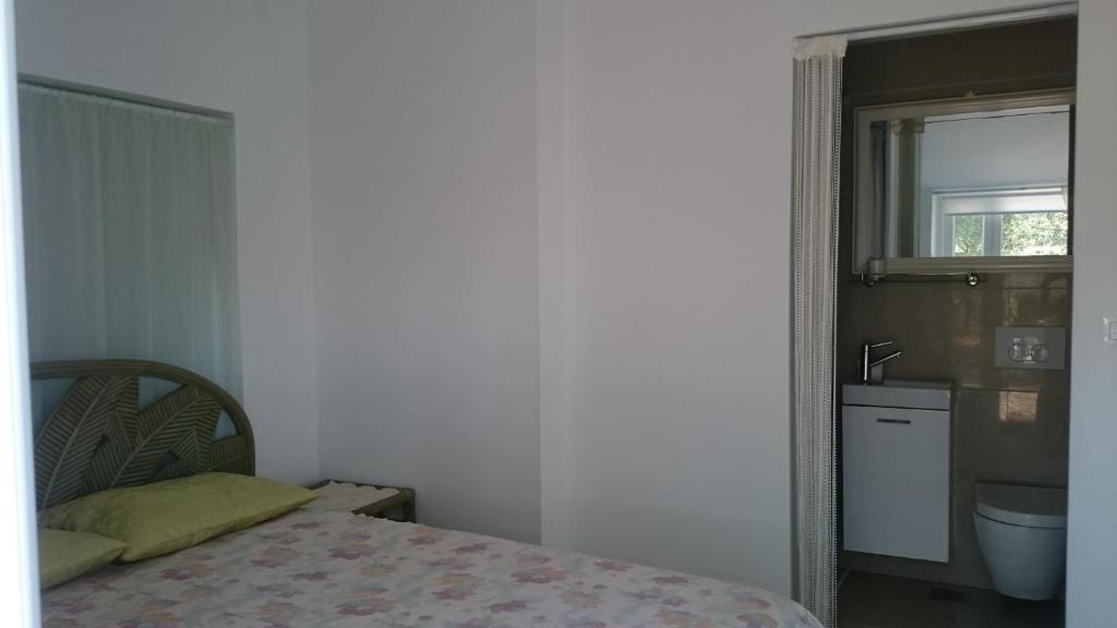 Posteľ alebo postele v izbe v ubytovaní Collins Apartments