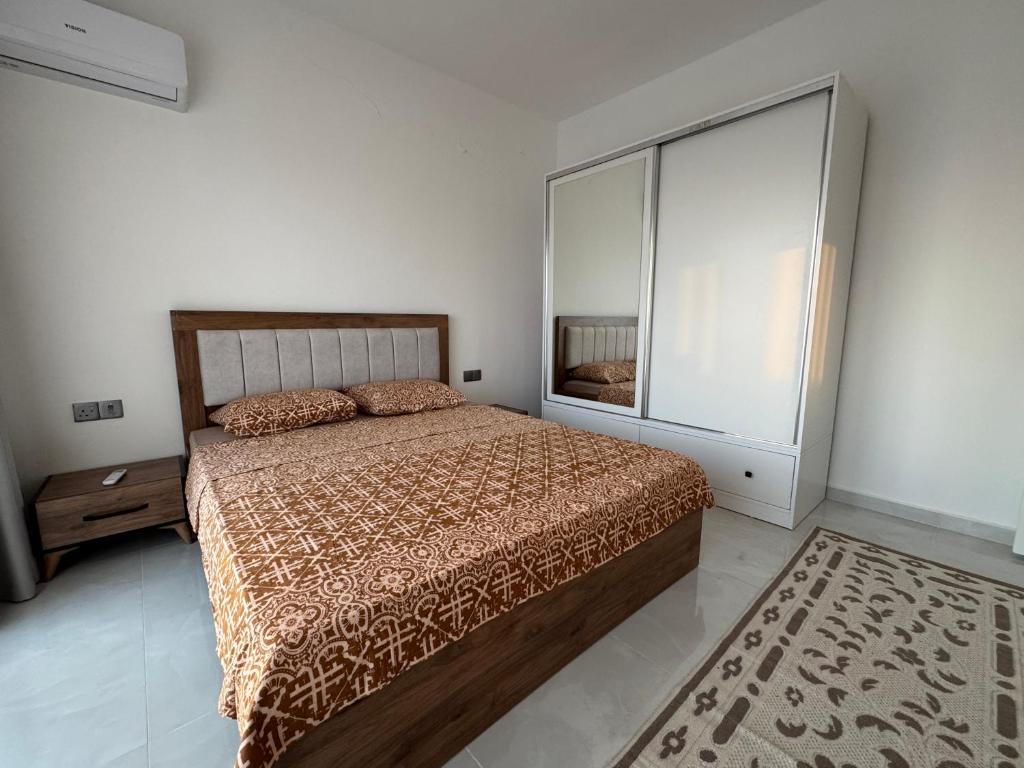 a bedroom with a bed and a large window at Caesar Resort Saturn Home Beach in İskele